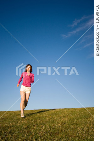 Young Woman Jogging In The Park Young Woman Jogging In The Park 13699716