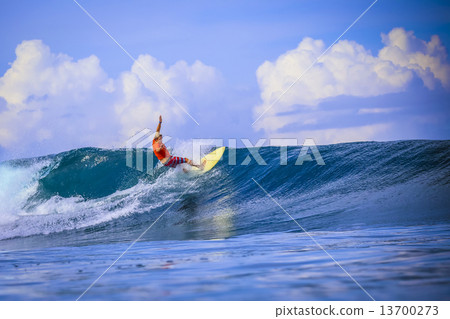 Surfer on Amazing Blue Wave 13700273