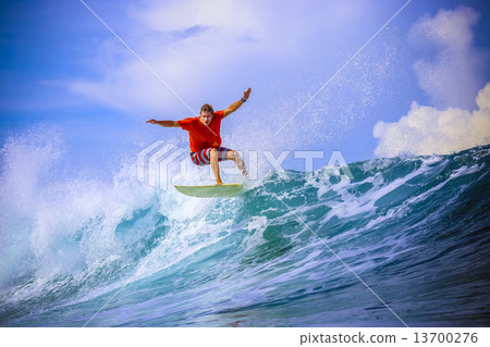 Surfer on Amazing Blue Wave 13700276