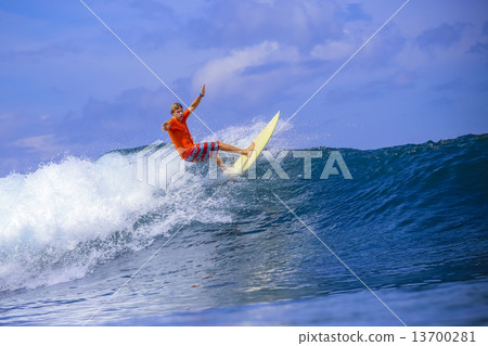 Surfer on Amazing Blue Wave 13700281