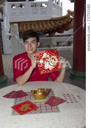 Man holding new year greetings Man holding new year greetings 13703380