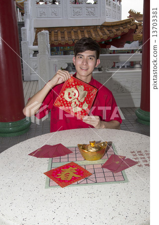 Man holding new year greetings Man holding new year greetings 13703381