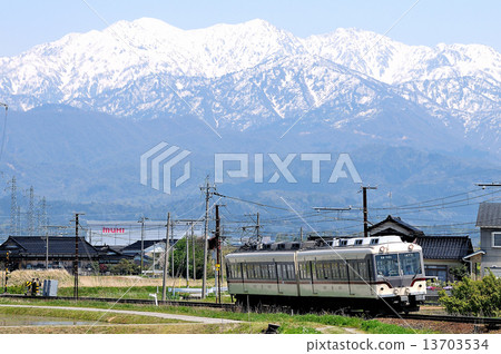 Toyama region railway and Tateyama mountain range 13703534