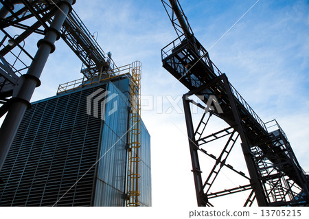 Towers of grain drying enterprise at sunny day Towers of grain drying enterprise at sunny day 13705215