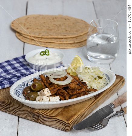 Gyros with Tzatziki Coleslaw olives and feta cheese 13705484