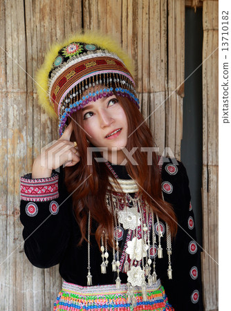 Traditionally dressed Mhong hill tribe woman thinking Traditionally dressed Mhong hill tribe woman thinking 13710182