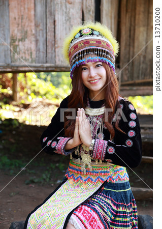 Traditionally dressed Mhong hill tribe woman pay respect Traditionally dressed Mhong hill tribe woman pay respect 13710200