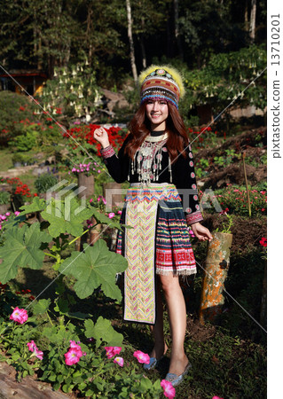 Traditionally dressed Mhong hill tribe woman in the garden Traditionally dressed Mhong hill tribe woman in the garden 13710201