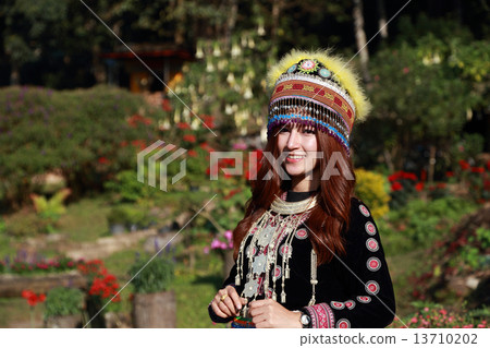 Traditionally dressed Mhong hill tribe woman in the garden Traditionally dressed Mhong hill tribe woman in the garden 13710202