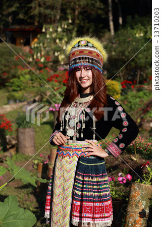 Traditionally dressed Mhong hill tribe woman in the garden Traditionally dressed Mhong hill tribe woman in the garden 13710203