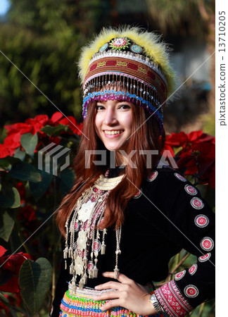 Traditionally dressed Mhong hill tribe woman in the garden Traditionally dressed Mhong hill tribe woman in the garden 13710205