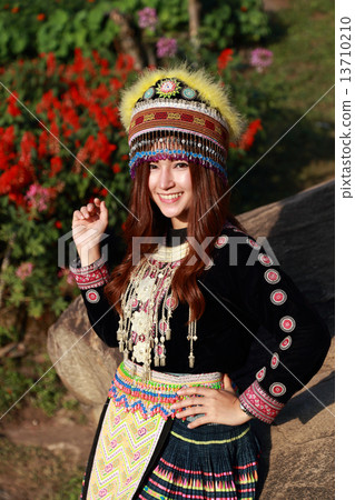Traditionally dressed Mhong hill tribe woman in the garden 13710210