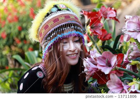 Traditionally dressed Mhong hill tribe woman in the garden 13711806