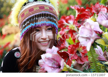 Traditionally dressed Mhong hill tribe woman in the garden Traditionally dressed Mhong hill tribe woman in the garden 13711807