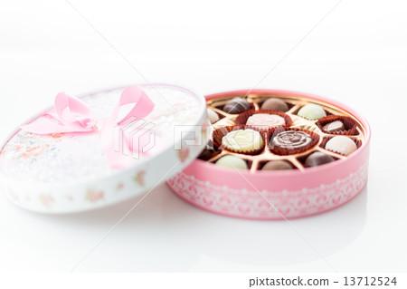 Chocolates in pink box on white background Chocolates in pink box on white background 13712524