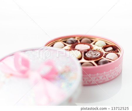 Chocolates in pink box on white background Chocolates in pink box on white background 13712525