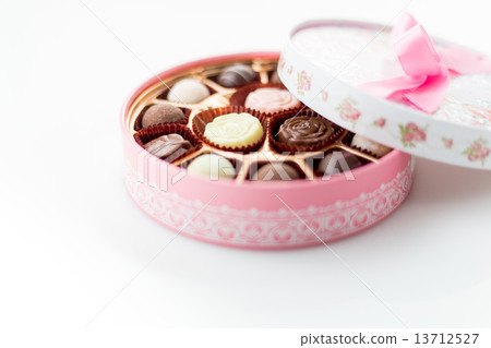Chocolates in pink box on white background Chocolates in pink box on white background 13712527