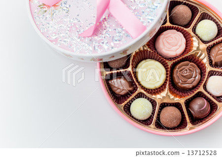 Chocolates in pink box on white background Chocolates in pink box on white background 13712528