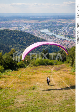 Paraglider running for take off Paraglider running for take off 13712950