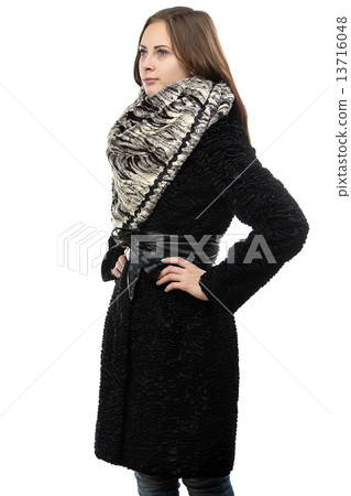 Photo of the young serious woman in fur coat  13716048