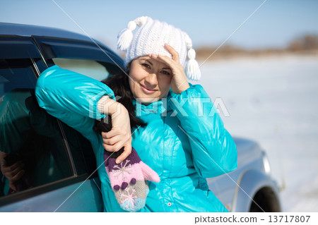 Beautiful woman in hat and mittens 13717807