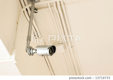 CCTV camera security system on reddish yellow ceiling background CCTV camera security system on reddish yellow ceiling background 13718735