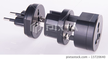 Travel plug adapter on a background 13720640