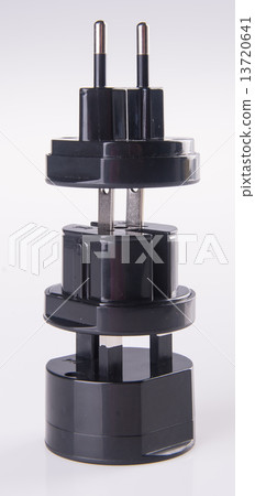 Travel plug adapter on a background Travel plug adapter on a background 13720641