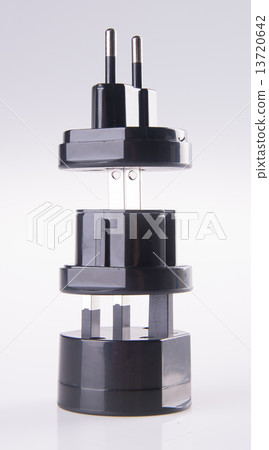 Travel plug adapter on a background 13720642