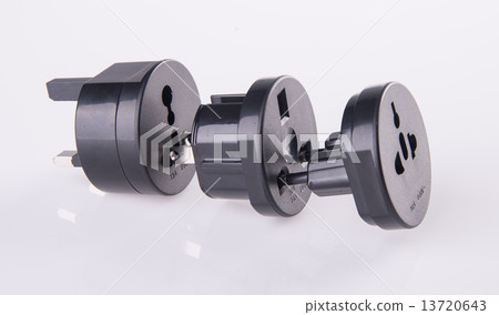 Travel plug adapter on a background 13720643