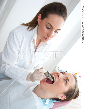 dentist with dental impression tray 13722379