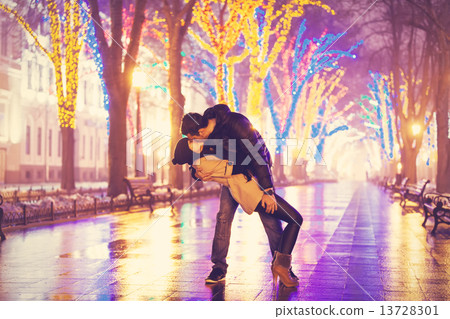 Couple kissing at night alley. Couple kissing at night alley. 13728301