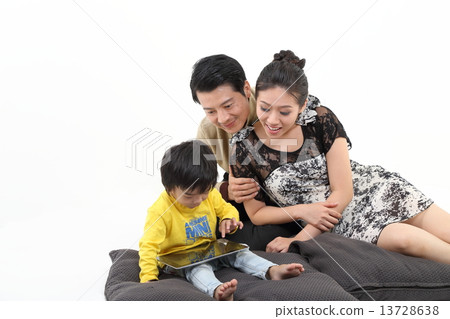 Parents and child playing 13728638