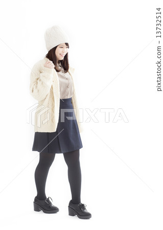A cute girl wearing a knit cap on a white sweater 13732514