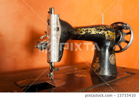 Classic retro style manual sewing machine ready for sewing work. 13733410