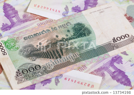 Different Cambodia Riels banknotes on the table Different Cambodia Riels banknotes on the table 13734198