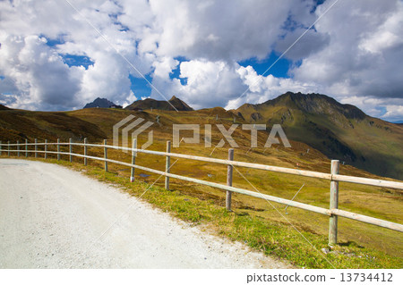 Empty ski slope in Tyrolean Alps in autumn, Austria 13734412