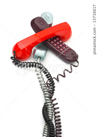 Heap of telephones 13738817