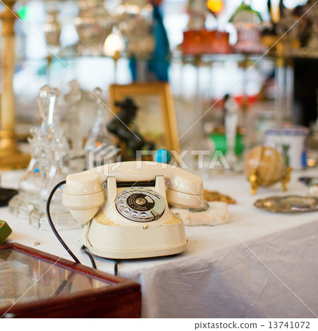 Vintage telephone on a Parisian flea market 13741072