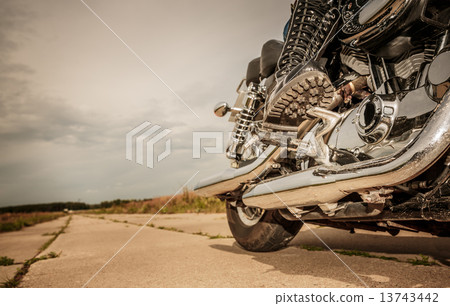 Biker girl riding on a motorcycle 13743442