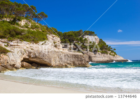 Mediterranean sea cliffs at Cala Mitjana beach at Menorca island Mediterranean sea cliffs at Cala Mitjana beach at Menorca island 13744646