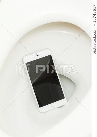 A smartphone dropped into the toilet 13745617
