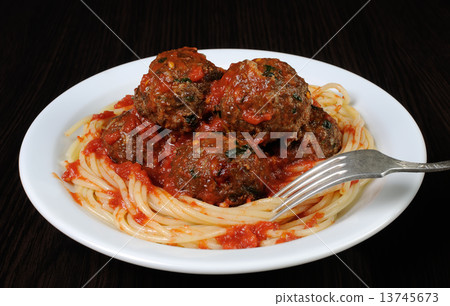 Meatballs in tomato sauce with spaghetti 13745673