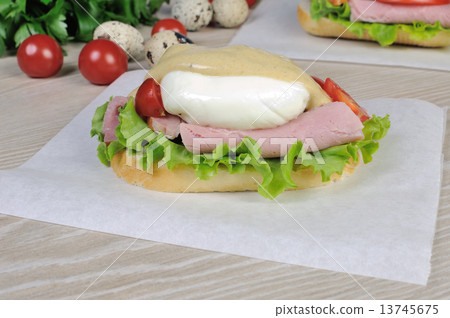 Sandwich with ham and poached egg. 13745675