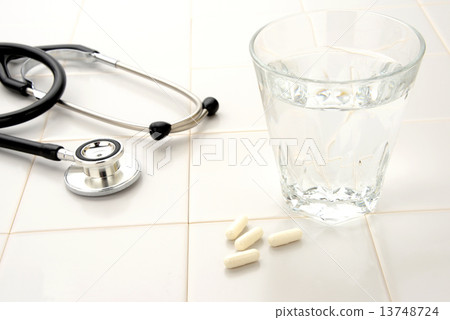 Diet image - supplement and water and stethoscope Diet image - supplement and water and stethoscope 13748724