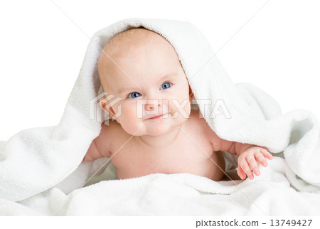 Cute smiling baby girl lying under towel after bathing Cute smiling baby girl lying under towel after bathing 13749427