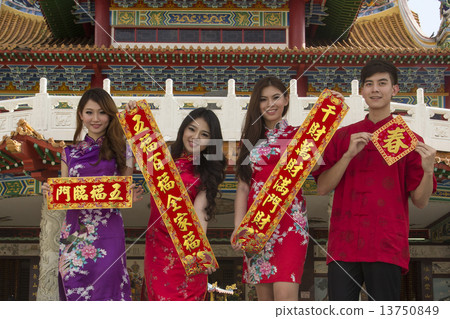 One man and three girls holding scrolls and greetings 13750849