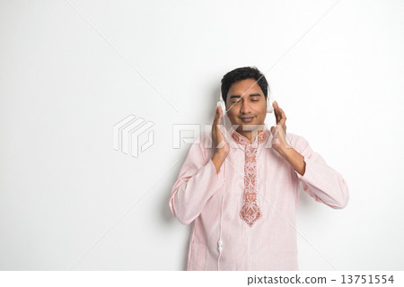 Traditional Young Indian Asian Male College Student listening mu Traditional Young Indian Asian Male College Student listening mu 13751554