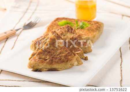 Martabak or murtabak, also mutabbaq, is a stuffed pancake is com 13751622