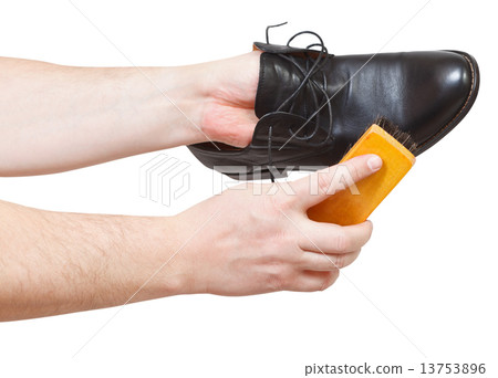 Shoeshiner cleaning black shoes by brush Shoeshiner cleaning black shoes by brush 13753896